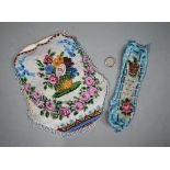 A 19th century glass beadwork pouch decorated with a basket of flowers to one side, and a