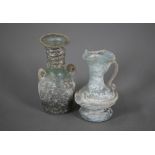 Two small Roman glass two-handled vases, 11 and 9 cm high