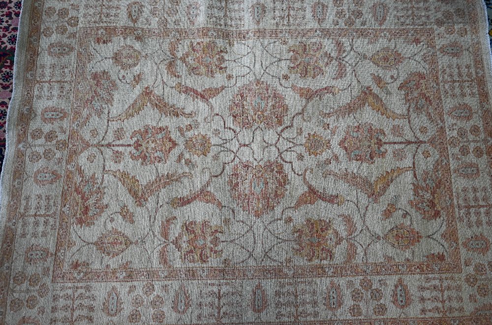 A contemporary Indian Agra carpet, the yelllow/ochre ground with muted floral design, 204 cm x 154 - Image 2 of 3