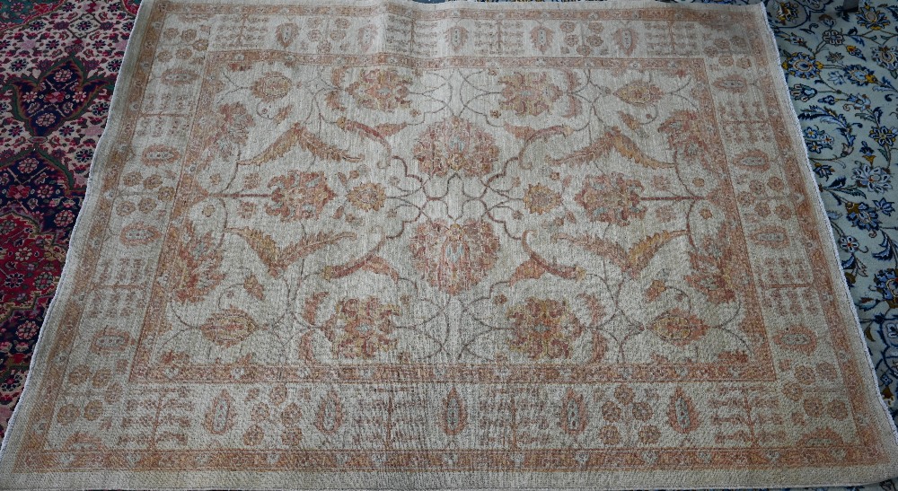 A contemporary Indian Agra carpet, the yelllow/ochre ground with muted floral design, 204 cm x 154