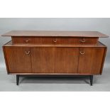 E Gomme/G-Plan, a mid-century 'Librenza'  teak sideboard, raised on ebonised legs, 149 cm w x 46