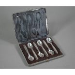 A cased set of six Georg Jensen 'Cactus' pattern coffee spoons, London Import 1930, 3oz