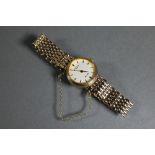 A Rotary Elite 9ct lady's wristwatch, with white dial within a 21 mm dia. case on link strap - 19.6g