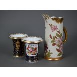 A pair of Regency porcelain spill-vases, the reserves painted with baskets of flowers on a blue