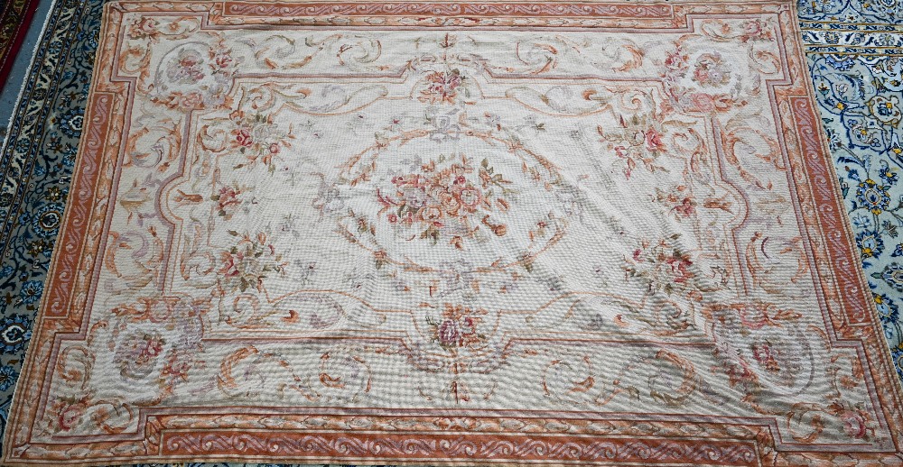A traditional Savonnerie needlepoint rug, pale camel ground, 266 cm x 173 cm