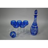 A blue flash cut glass decanter and stopper, to/w six wine glasses