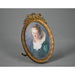 An early 20th century oval portrait miniature on ivory of a young lady in 17th century costume,