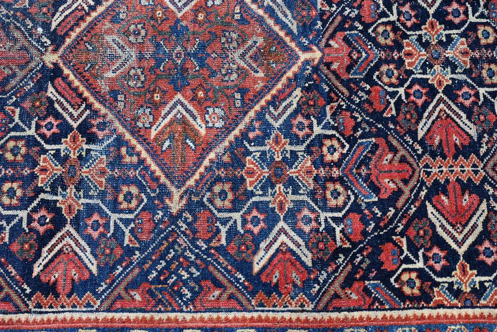 An old Persian Mahal rug, the blue ground centred by a medallion, 202 cm x 140 cm - Image 2 of 3