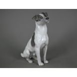 A Royal Copenhagen seated terrier 1452/753, (underglaze blue L Nr 870A and wave mark), 23 cm high