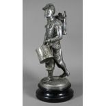 After Emille Guillemin, a late 19th century French silver patinated spelter figure of a drummer of