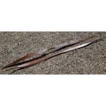 Two antique Andaman Islands tribal carved wood bows of flattened blade form with tapering handles