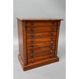 A Victorian miniature Wellington collectors chest of eight drawers, on a plinth base, 48 cm w x 30