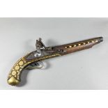 An Indo-Persian flintlock pistol with 25 cm barrel, the walnut fullstock richly inlaid with bone and