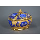 A Berlin KPM porcelain trinket box and cover with fir cone finial and mid-blue ground with