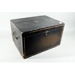 An early 19th century Chinese black lacquer rectangular tea chest with brass handles, the hinged