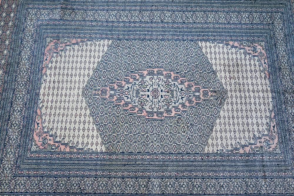 A Pakistani Bokhara design rug, camel ground, 192 x 121 cm - Image 2 of 3