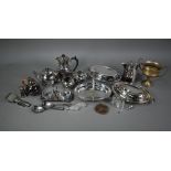 An Arts & Crafts electroplated four-piece tea service of planished and riveted design, to/w two