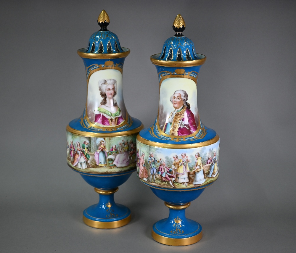 A large pair of late 19th century French porcelain baluster vases, the pierced dome covers with