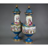 A large pair of late 19th century French porcelain baluster vases, the pierced dome covers with