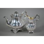 A Victorian silver melon-shaped teapot with cast melon finial and scroll handle with ivory