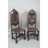 A pair of late 19th century walnut framed hall chairs, the studded brass leather seat and back in