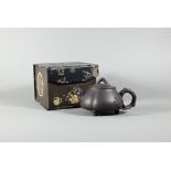 A Chinese dark brown Yixing teapot and cover (possibly Zini clay) shi piao tripod form with