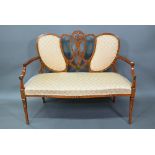 An Edwardian Sheraton Revival polychrome decorated satinwood sofa, with fabric back panels over an