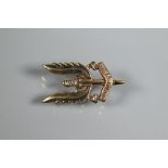 An SAS Special Air Service 9ct yellow gold regimental brooch in the form of the winged dagger with