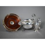 A silver sauce-boat in the Georgian manner with scroll handle and hoof feet, Mappin & Webb,