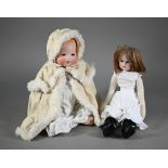 An Armand Marseille AM351/3 1/2 k bisque-headed baby doll with fixed blue eyes and open mouth with