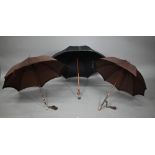 A lady's vintage umbrella by Kendal, with brown silk canopy on rosewood handle with gilt metal