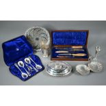 A Victorian cased set of four epns serving spoons with matching grape scissors, to/w a foliate-