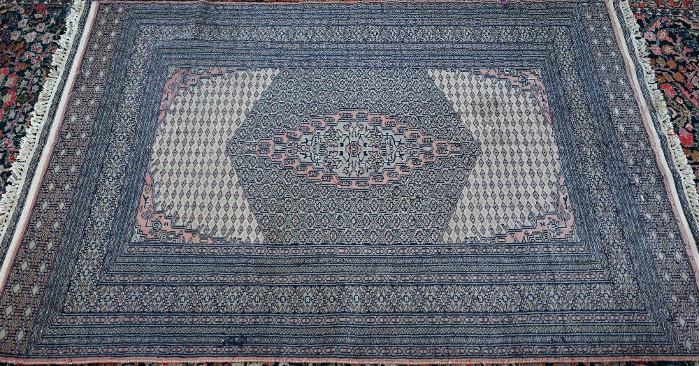 A Pakistani Bokhara design rug, camel ground, 192 x 121 cm