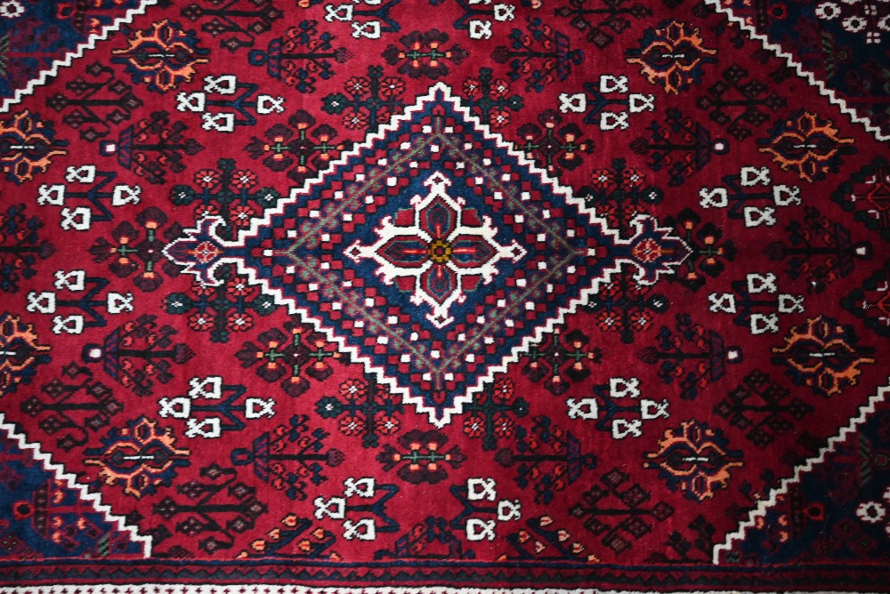 A North West Persian Josheghan rug, the deep red ground with geometric design, 215 cm x 135 cm - Image 2 of 3