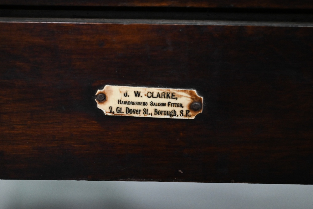 An early 20th century barber's chair, bears makers plate for J W Clarke, Borough, London - Image 8 of 8