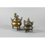 A small Chinese brass tripod censer with domed cover, six-character Xuande mark to base but not of