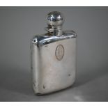 A silver hip flask, the hinged bun cover with bayonet closure, Goldsmiths & Silversmiths Co. Ltd,