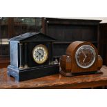 A 19th century slate architectural mantel clock with twin train movement striking on coiled gong, 32