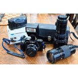 A Minolta 7000 SLR 35 mm camera, with AF zoom 35-70 mm 1:4 (22) lens, AF zoom 70-210 mm 1:4 (32)