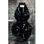 A large black-glazed porcelain double-gourd vase, 40 cm