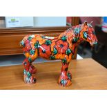 An Anita Harris pottery horse decorated with poppies, signed 'SJ', 28 x 34 cm