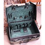A vintage crocodile-skin suitcase with green satin lining (lacks fittings), by Drew & Sons of