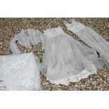 A vintage lace, gauze and silk wedding dress with petticoat, full pleated underskirt, buttoned