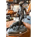 A large Continental bronze group of a huntsman and dog, unsigned, 62 cm high on oval base