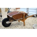 An old teak wheelbarrow