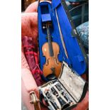 A cased Buffet clarinet, to/w a violin and bow and two folding music stands (4)