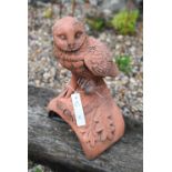 A cast terracotta owl ridge tile