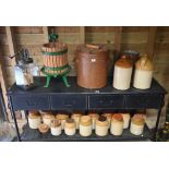 Fourteen salt-glazed stoneware storage jars to/w larger example, two one-gallon flagons, large