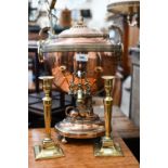 A Regency copper samovar with sphynx finial and gryphons' head handles, on gryphon stem and oval