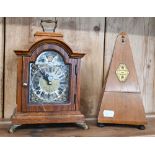 A small oak cased mantel clock striking on a coiled gong, to/w a French metronome (2)